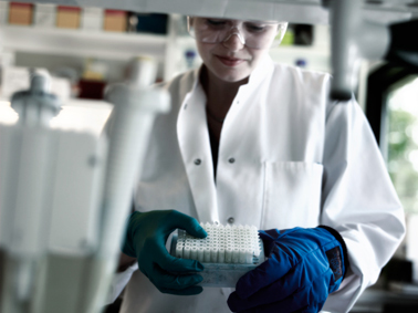 Woman in lab coat in a laboratory